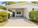 Covered entryway to a white single wide manufactured home at 32334 Oak Park Dr, Leesburg, FL 34748