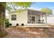 Exterior view of the house with a screened porch at 32334 Oak Park Dr, Leesburg, FL 34748