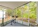 Screened porch with weight bench and exercise equipment at 32334 Oak Park Dr, Leesburg, FL 34748