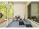 Screened porch with seating and storage at 32334 Oak Park Dr, Leesburg, FL 34748