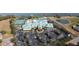 Aerial view of the Traditions community clubhouse, tennis courts and extensive parking at 3441 Grenville Dr, Winter Haven, FL 33884