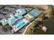 Community clubhouse with pool, tennis courts, and parking at 3441 Grenville Dr, Winter Haven, FL 33884