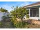 Lemon tree in backyard with brick paved patio at 3441 Grenville Dr, Winter Haven, FL 33884