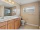 Bathroom with a large vanity, tiled floors, and a glass-enclosed shower at 3441 Grenville Dr, Winter Haven, FL 33884