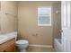 Small bathroom with shower, toilet and single vanity at 3441 Grenville Dr, Winter Haven, FL 33884