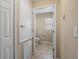 Compact bathroom with a toilet, small window, and tiled floor at 3441 Grenville Dr, Winter Haven, FL 33884