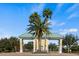 Gated community entrance with palm trees at 3441 Grenville Dr, Winter Haven, FL 33884