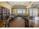 Community library with large windows, comfortable seating, and built-in bookshelves at 3441 Grenville Dr, Winter Haven, FL 33884