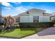 Light green house with a well-maintained lawn and shrubs at 3441 Grenville Dr, Winter Haven, FL 33884
