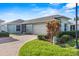 Single-story home with attached garage and landscaped front yard at 3441 Grenville Dr, Winter Haven, FL 33884