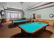 Community game room featuring pool tables, comfortable seating, and a relaxing atmosphere at 3441 Grenville Dr, Winter Haven, FL 33884