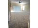 Spacious living room with plush carpeting, a ceiling fan, and sliding glass doors at 3441 Grenville Dr, Winter Haven, FL 33884