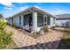 Screened-in patio with brick pavers and seating area at 3441 Grenville Dr, Winter Haven, FL 33884