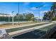 Community shuffleboard courts with pergola covered benches and lush landscaping at 3441 Grenville Dr, Winter Haven, FL 33884