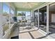 Bright sunroom with sliding glass doors and tile floor at 3441 Grenville Dr, Winter Haven, FL 33884