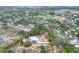 Aerial view showing a light blue house on a spacious lot with surrounding homes and trees at 3960 Laurel Se Ave, Lakeland, FL 33812
