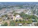 Aerial view of a home on a spacious lot with mature trees at 3960 Laurel Se Ave, Lakeland, FL 33812