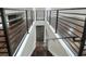 Modern staircase leading downstairs with dark wood steps and metal railing at 3960 Laurel Se Ave, Lakeland, FL 33812