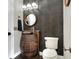 Rustic bathroom with a barrel sink and dark wallcovering at 3960 Laurel Se Ave, Lakeland, FL 33812