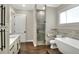 Modern bathroom with a freestanding tub, shower, and quartz countertop at 3960 Laurel Se Ave, Lakeland, FL 33812