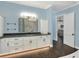 Bright bathroom with double vanity and access to bedroom at 3960 Laurel Se Ave, Lakeland, FL 33812