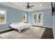 Serene bedroom with light blue walls and access to the backyard at 3960 Laurel Se Ave, Lakeland, FL 33812