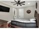 Spacious bedroom with a large TV and comfortable bed at 3960 Laurel Se Ave, Lakeland, FL 33812