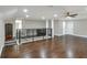 Large bonus room with hardwood floors, fireplace, and built-in bar area at 3960 Laurel Se Ave, Lakeland, FL 33812