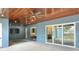 Covered patio with built-in fireplace and sliding glass doors at 3960 Laurel Se Ave, Lakeland, FL 33812