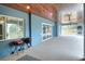 Spacious covered patio with wood ceiling and multiple ceiling fans at 3960 Laurel Se Ave, Lakeland, FL 33812
