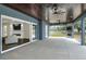 Large covered patio with concrete flooring and fireplace at 3960 Laurel Se Ave, Lakeland, FL 33812