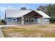 Ranch style home with metal roof and stone accents at 3960 Laurel Se Ave, Lakeland, FL 33812