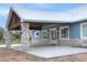 Covered entryway with stone columns and chandelier at 3960 Laurel Se Ave, Lakeland, FL 33812