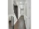 Long hallway with dark hardwood floors and white wainscoting at 3960 Laurel Se Ave, Lakeland, FL 33812