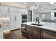 Spacious kitchen with island, white cabinets, and stainless steel appliances at 3960 Laurel Se Ave, Lakeland, FL 33812
