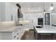 Modern kitchen with white cabinets, quartz countertops, and double ovens at 3960 Laurel Se Ave, Lakeland, FL 33812