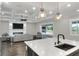 Open living room with fireplace and sliding glass doors leading to backyard at 3960 Laurel Se Ave, Lakeland, FL 33812