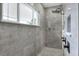 Large walk-in shower with pebble floor and modern fixtures at 3960 Laurel Se Ave, Lakeland, FL 33812