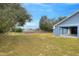 Large grassy side yard with a wooden fence at 3960 Laurel Se Ave, Lakeland, FL 33812