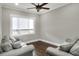 Cozy sitting room with hardwood floors and large window at 3960 Laurel Se Ave, Lakeland, FL 33812
