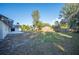Large backyard with a fenced area and green grass at 410 N Tecumseh Ave, Fort Meade, FL 33841