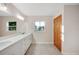 Modern bathroom with double vanity and window at 410 N Tecumseh Ave, Fort Meade, FL 33841