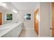 Updated bathroom with double vanity and window at 410 N Tecumseh Ave, Fort Meade, FL 33841