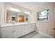 Double vanity with white cabinets and quartz countertops at 410 N Tecumseh Ave, Fort Meade, FL 33841