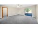 Spacious bedroom with ceiling fan and backyard access at 410 N Tecumseh Ave, Fort Meade, FL 33841