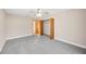 Spacious bedroom with ceiling fan and large closet at 410 N Tecumseh Ave, Fort Meade, FL 33841