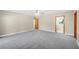 Bright bedroom with access to bathroom and hallway at 410 N Tecumseh Ave, Fort Meade, FL 33841