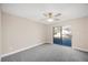 Bright bedroom featuring sliding glass doors to backyard at 410 N Tecumseh Ave, Fort Meade, FL 33841