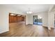 Dining room with hardwood floors and access to the living room and patio at 410 N Tecumseh Ave, Fort Meade, FL 33841