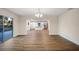 Dining area with hardwood floors and view of kitchen at 410 N Tecumseh Ave, Fort Meade, FL 33841